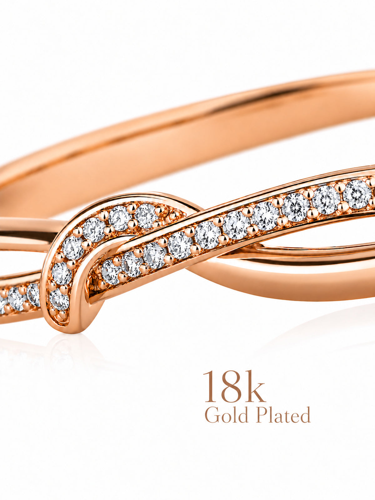 Close-up of Sparkling Twist bracelet’s crossing rose-gold curves and clear stones