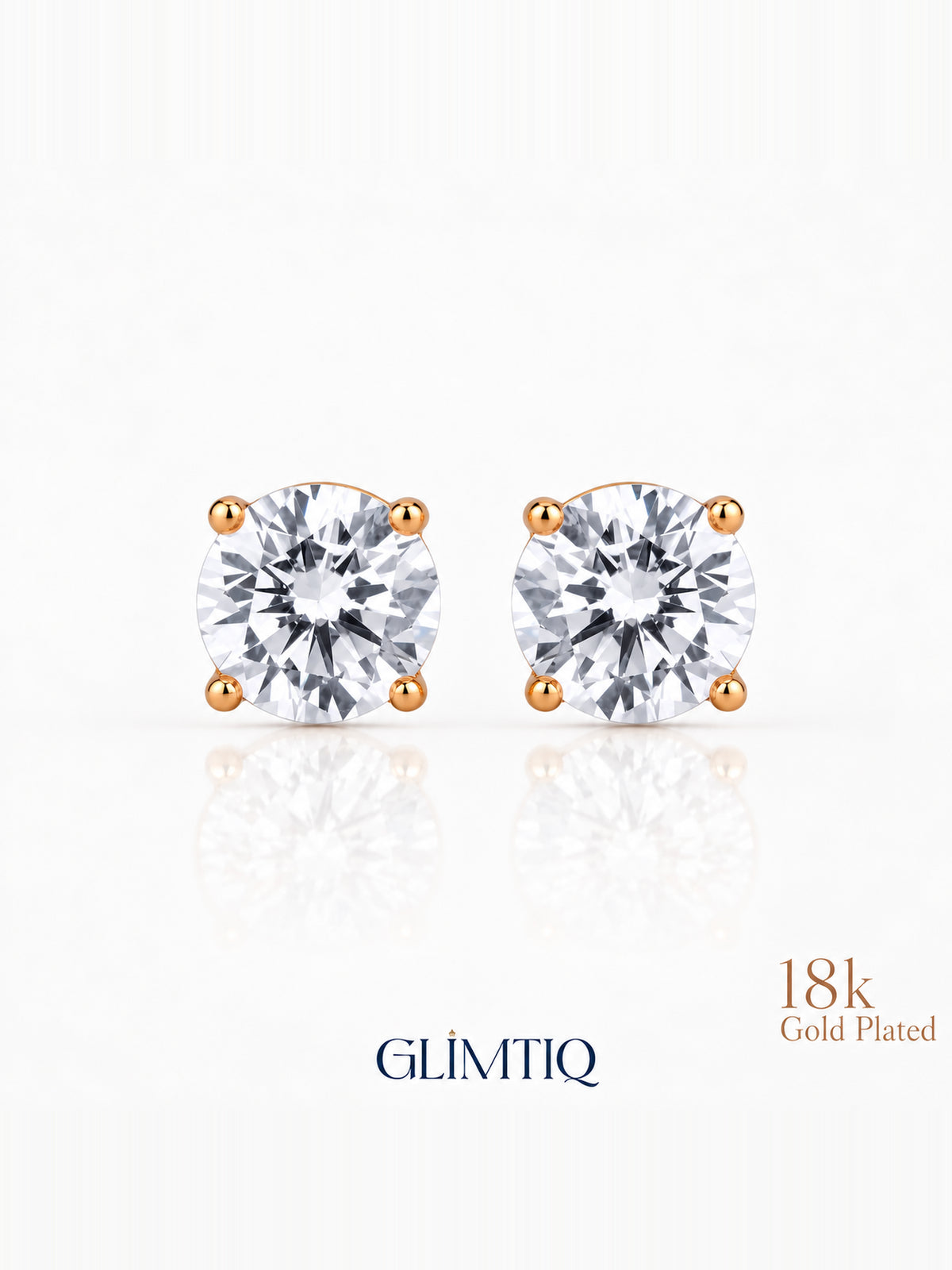 Close view of Celeste Round clear-centre stud earrings with warm gold-toned prongs