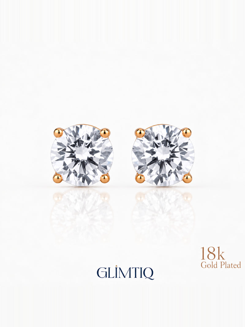 Close view of Celeste Round clear-centre stud earrings with warm gold-toned prongs