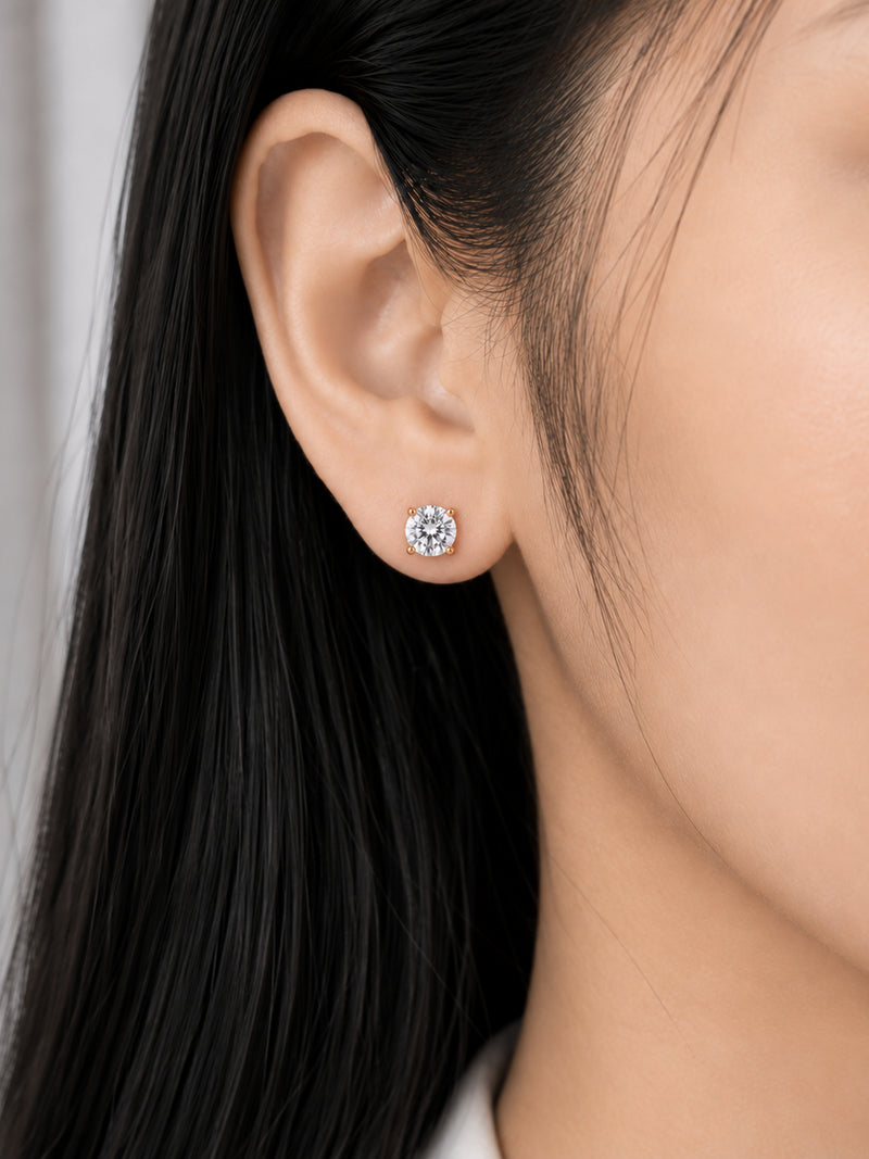 Celeste Round stud earring worn on a model's ear