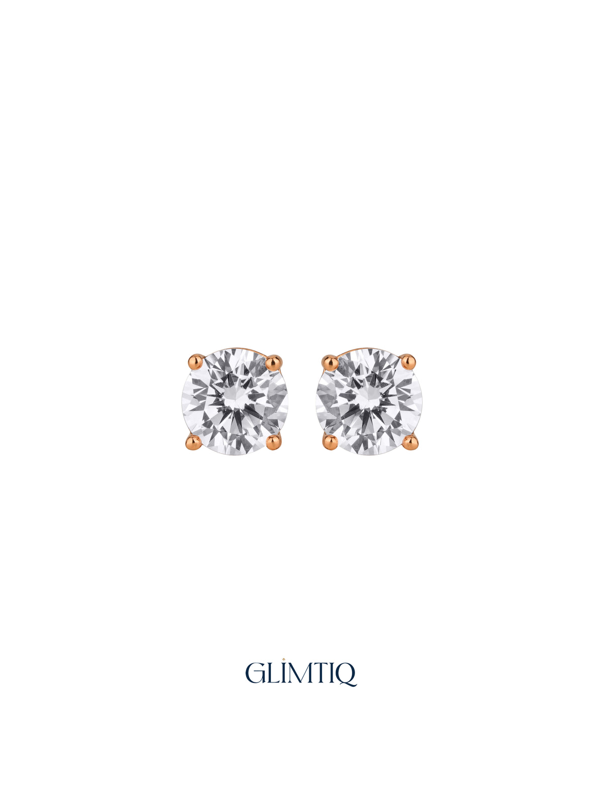 Pair of Celeste Round gold-plated stud earrings with clear round centres in four-prong settings