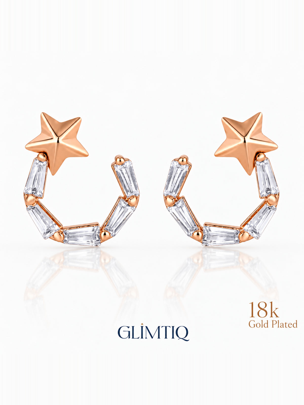 Close view of celestial star 18k rose gold plated drop earrings showing star top with an open curved drop of clear rectangular accents