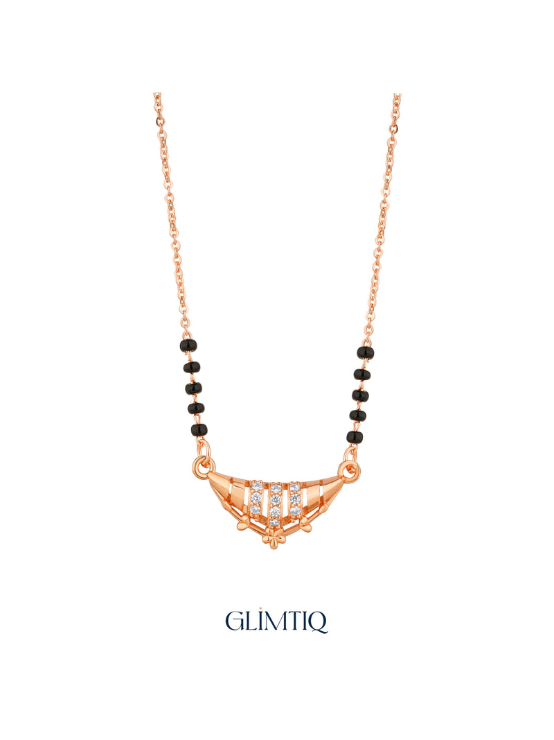 Close-up of rose gold crescent floral mangalsutra pendant with sparkling stone rows and delicate floral detail.