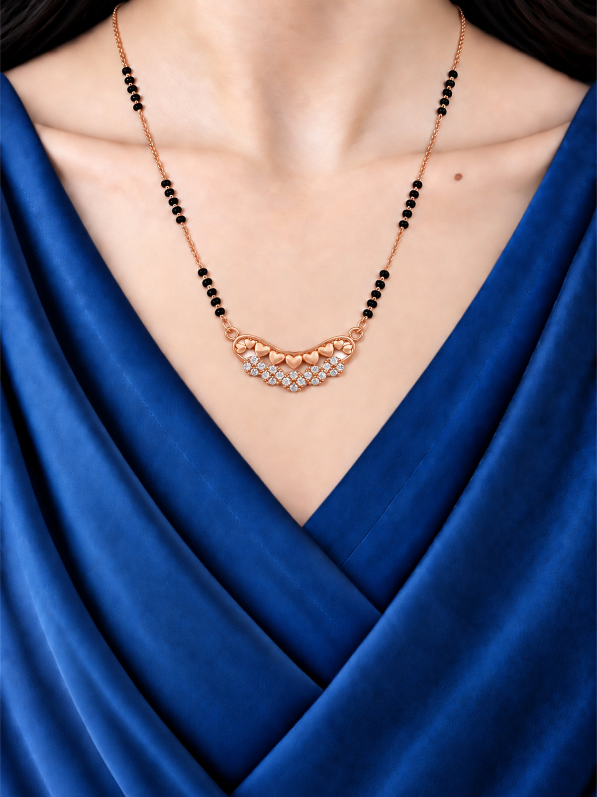 Forever Hearts Bloom mangalsutra with black beads shown worn on a model.
