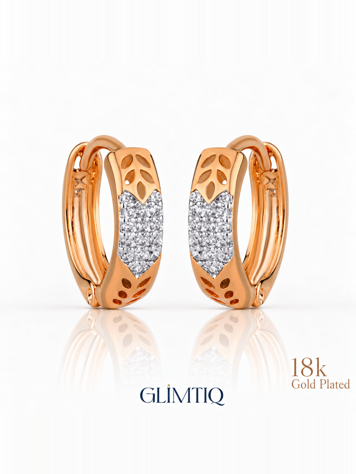 Close view of golden leaf 18k rose gold plated hoops showing leaf cutouts with a sparkling front panel