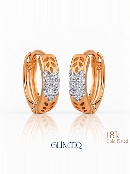 Close view of golden leaf 18k rose gold plated hoops showing leaf cutouts with a sparkling front panel