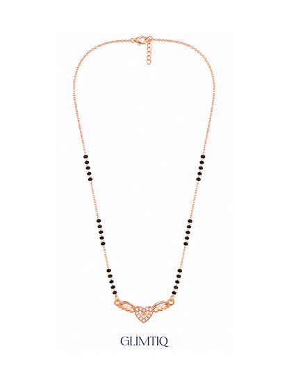 Full rose gold mangalsutra showing black bead sections, sparkling double-heart pendant with heart-shaped wings, lobster clasp and extension chain.