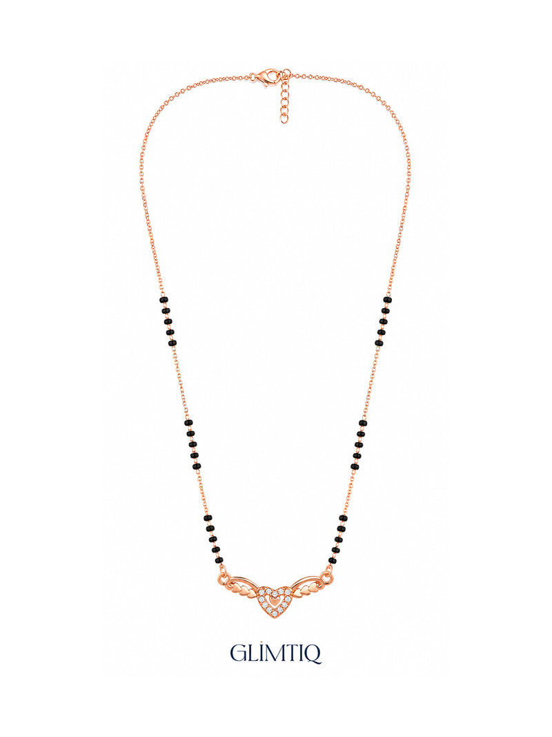 Full rose gold mangalsutra showing black bead sections, sparkling double-heart pendant with heart-shaped wings, lobster clasp and extension chain.