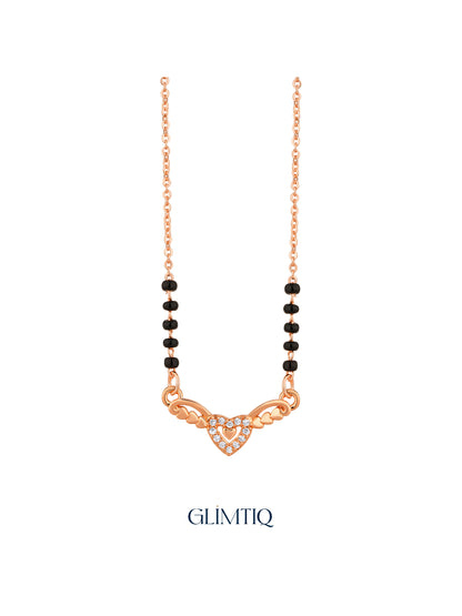 Close-up of rose gold mangalsutra pendant featuring sparkling double-heart pendant with heart-shaped wings.