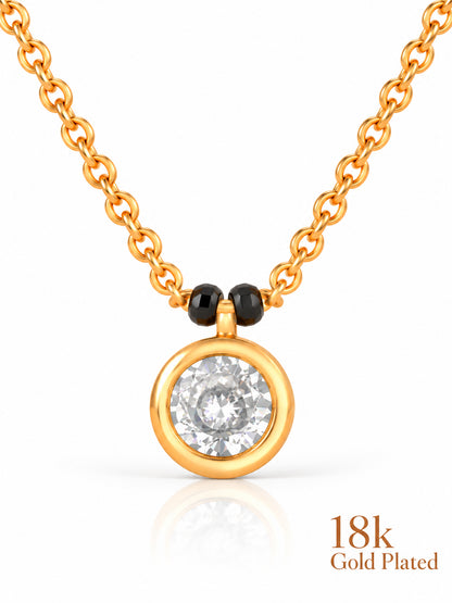 Close-up of Round Bezel Solitaire pendant and gold plating mark