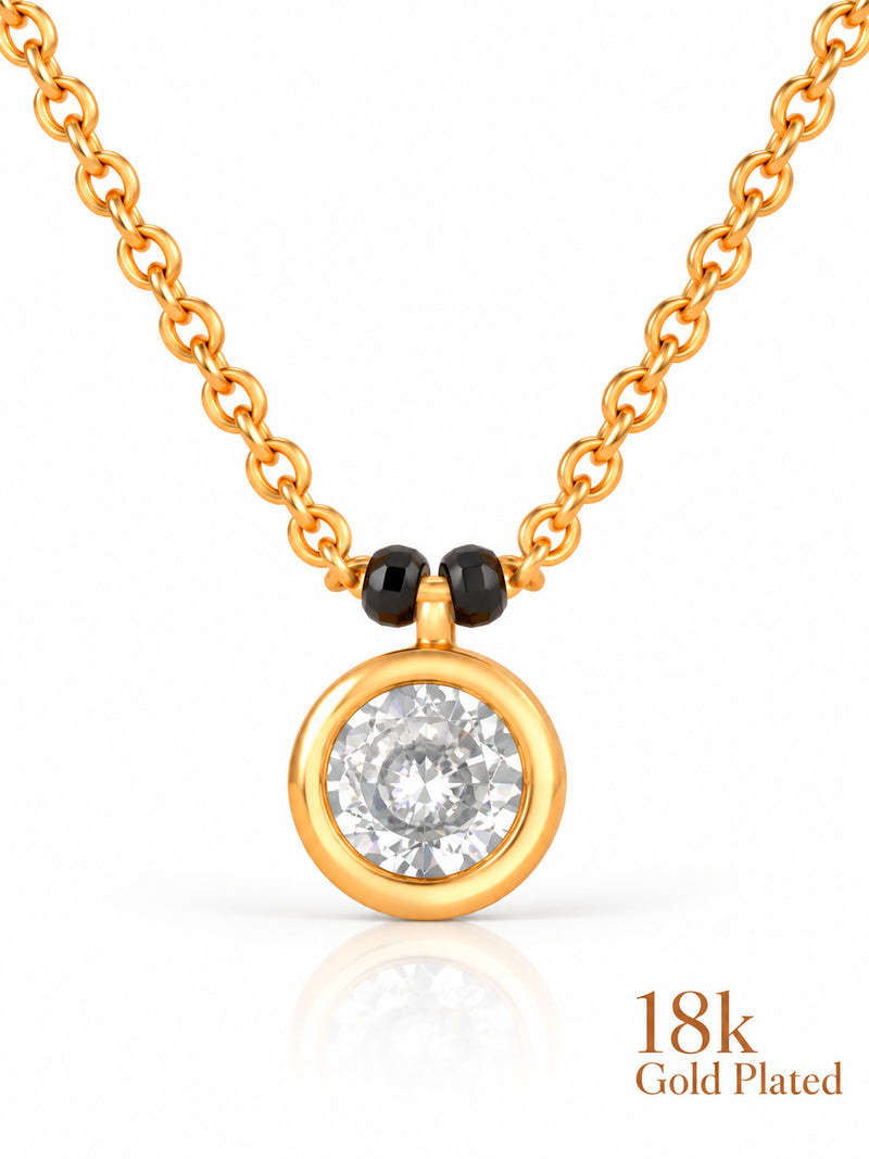 Close-up of Round Bezel Solitaire pendant and gold plating mark
