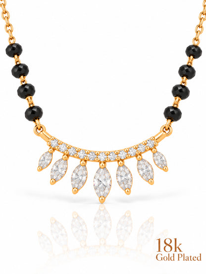 Close-up of Marquise Fringe Arc pendant and gold plating mark