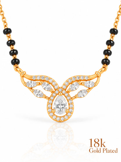 Close-up of Pear Halo Winged Arc pendant and gold plating mark