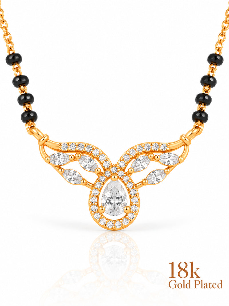 Close-up of Pear Halo Winged Arc pendant and gold plating mark