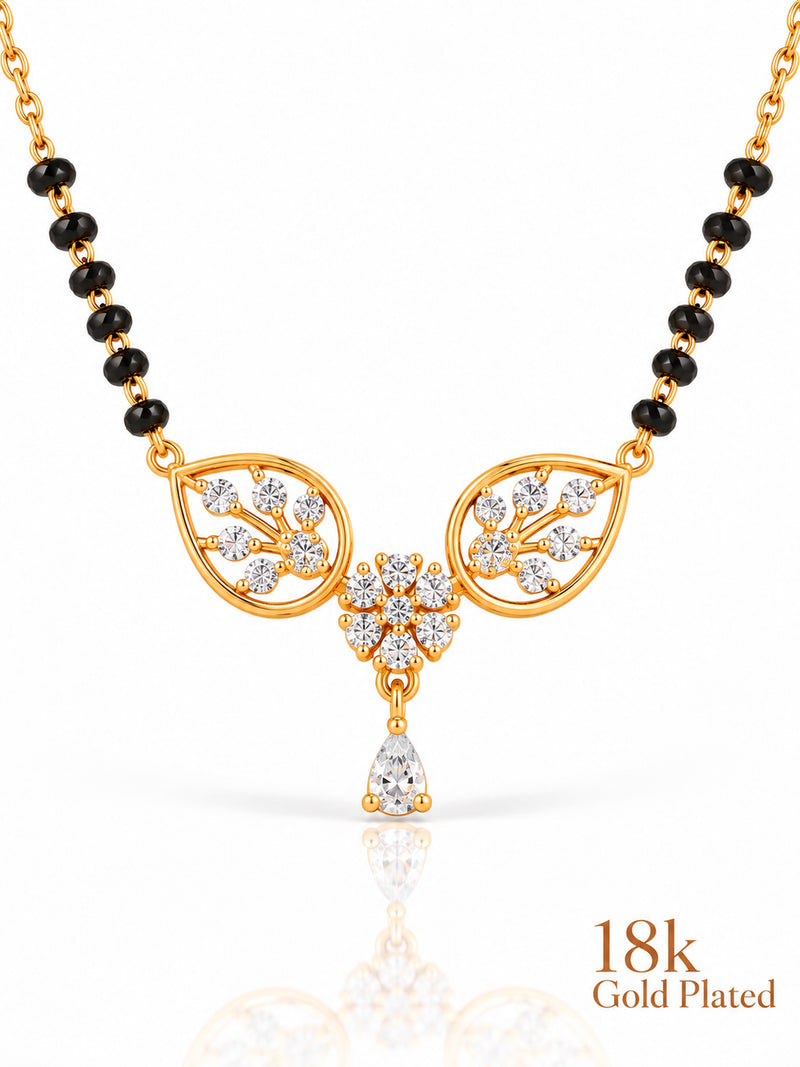 Close-up of Botanical Blossom Dewdrop pendant and gold plating mark