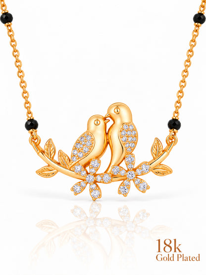 Close-up of Lovebirds on Branch pendant and gold plating mark