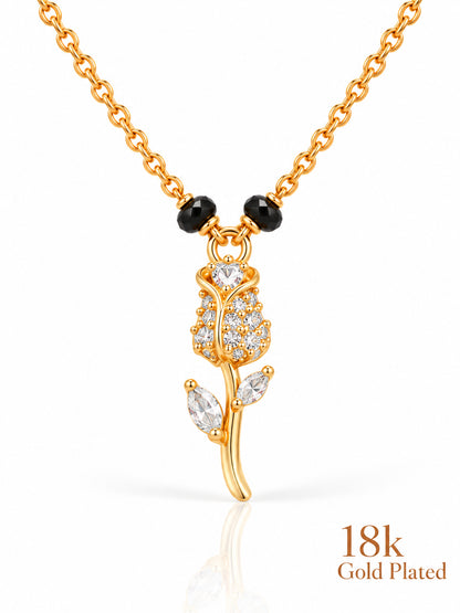 Close-up of Rose Stem pendant and gold plating mark