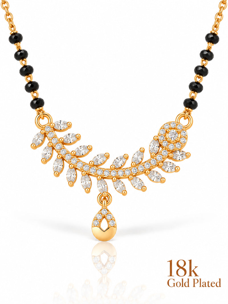 Close-up of Floral Rosette Teardrop pendant and gold plating mark
