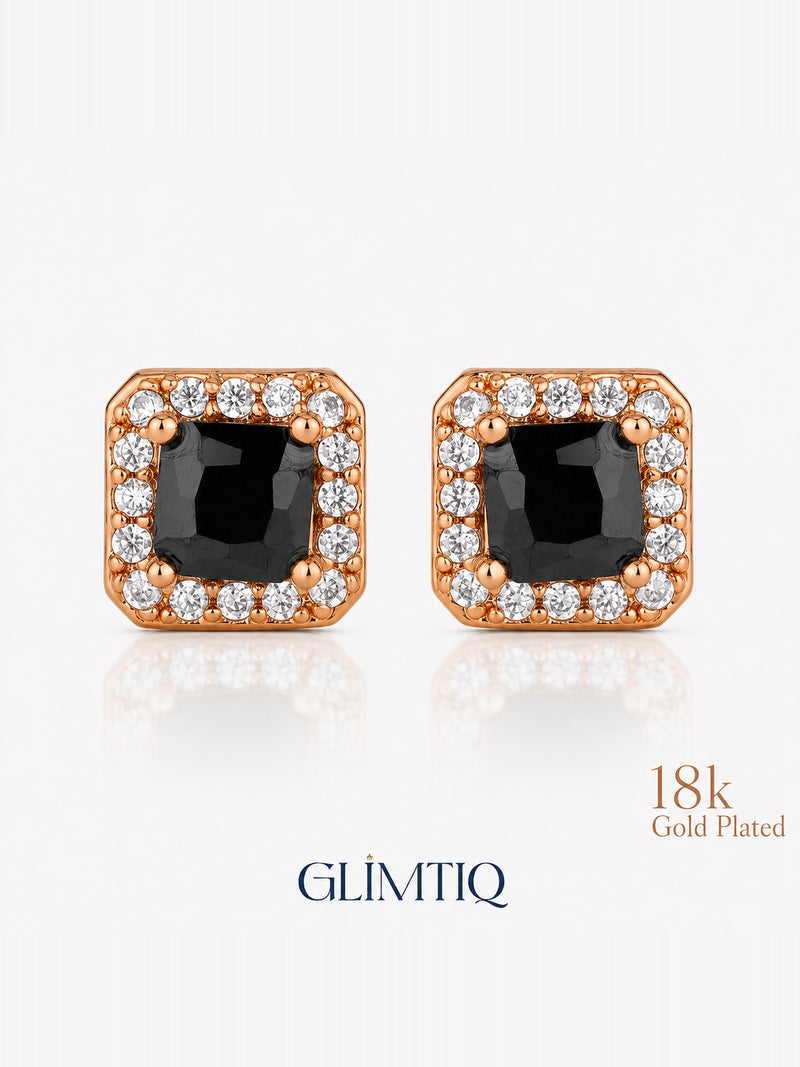Close view of the pair of square black-centre earrings with clear accent borders