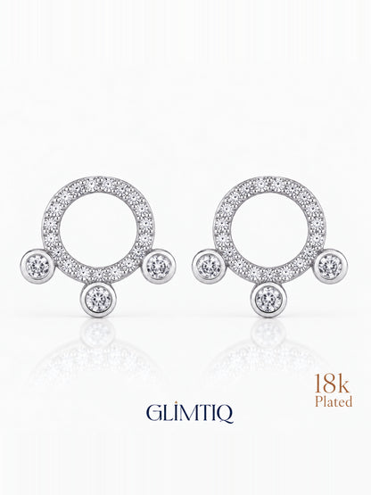 Close view of orbit trio 18k gold plated stud earrings showing sparkling open circle with three round accents