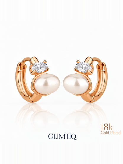 Close view of pearl duet 18k rose gold plated hoop earrings showing pearl-like white accent and clear round accent on a small hoop