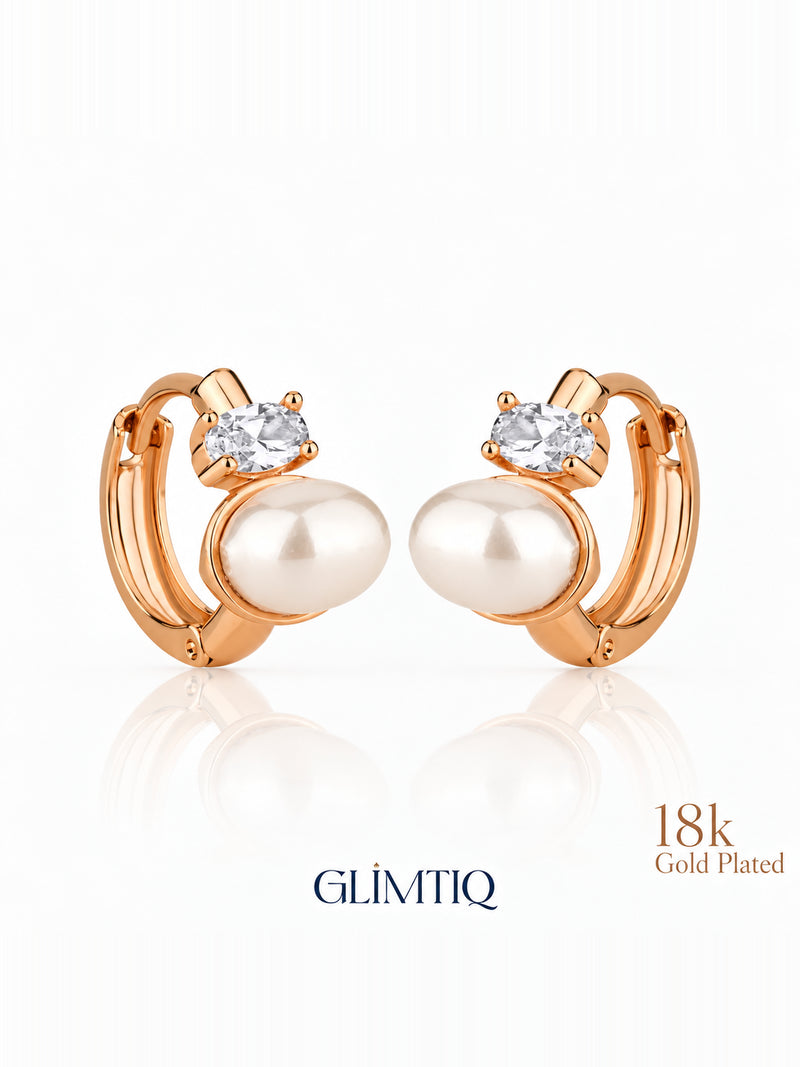 Close view of pearl duet 18k rose gold plated hoop earrings showing pearl-like white accent and clear round accent on a small hoop