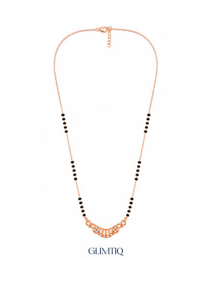 Full rose gold mangalsutra showing black bead sections, crescent pendant with two sparkling flowers and petal details, lobster clasp and extension chain.