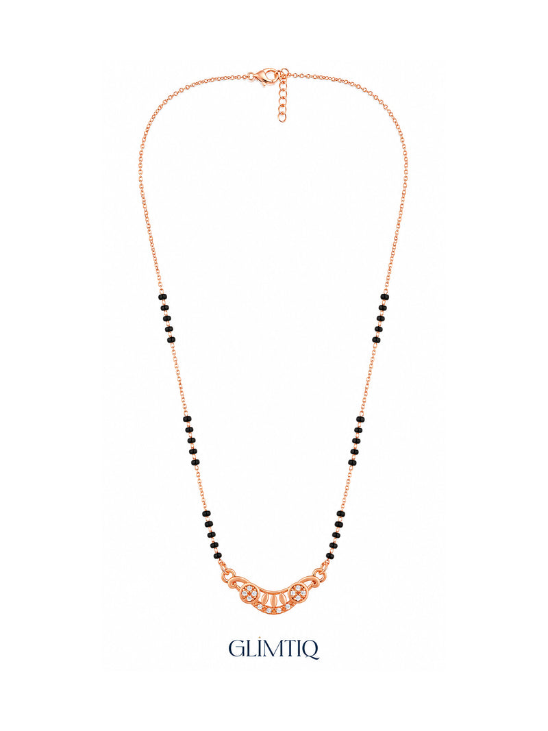 Full rose gold mangalsutra showing black bead sections, crescent pendant with two sparkling flowers and petal details, lobster clasp and extension chain.