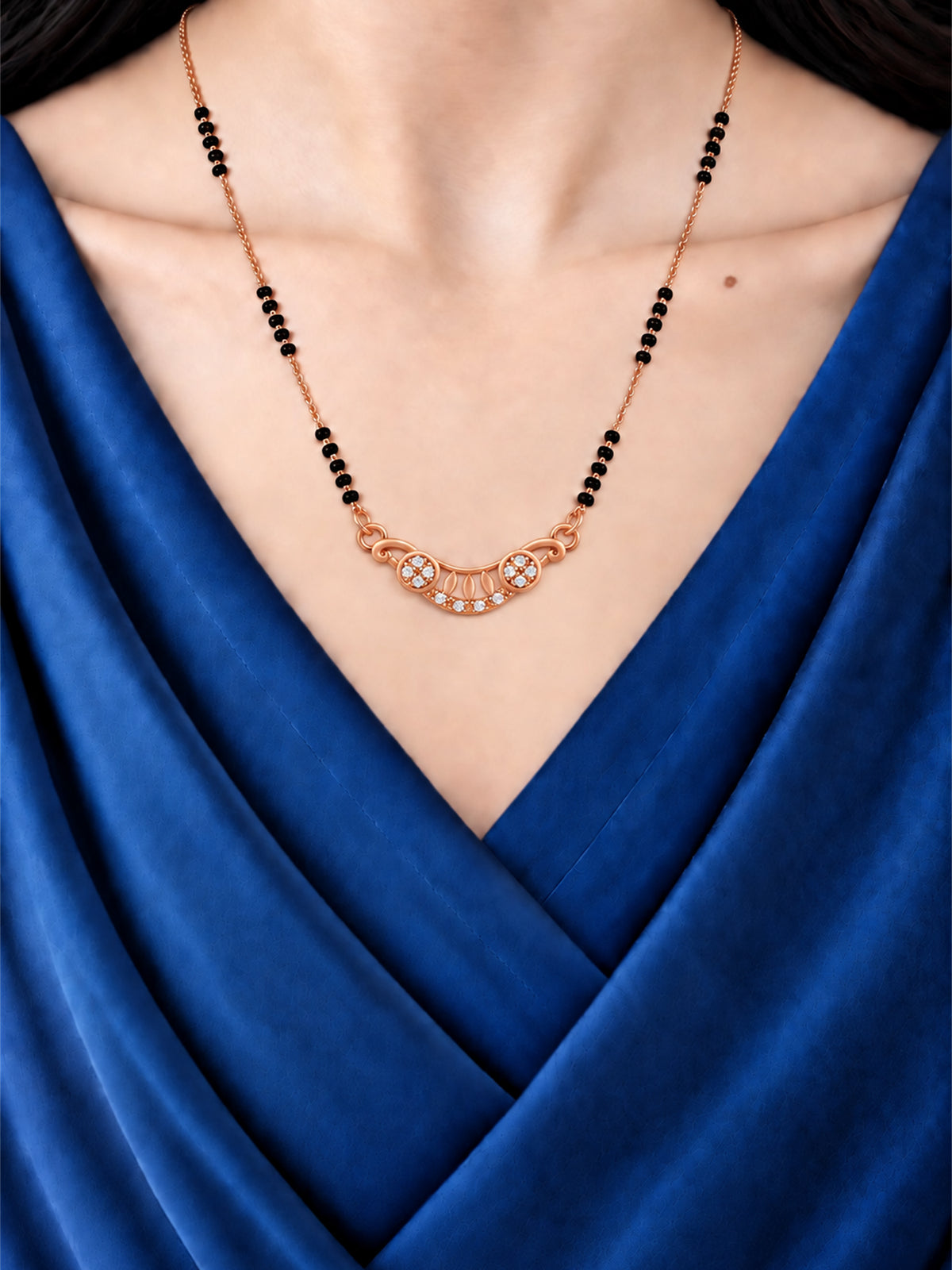 Shining Twin Flower Crescent mangalsutra with black beads shown worn on a model.
