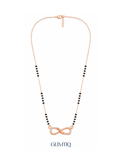 Full rose gold mangalsutra showing black bead sections, flowing infinity pendant with sparkling accents and textured centre detailing, lobster clasp and extension chain.