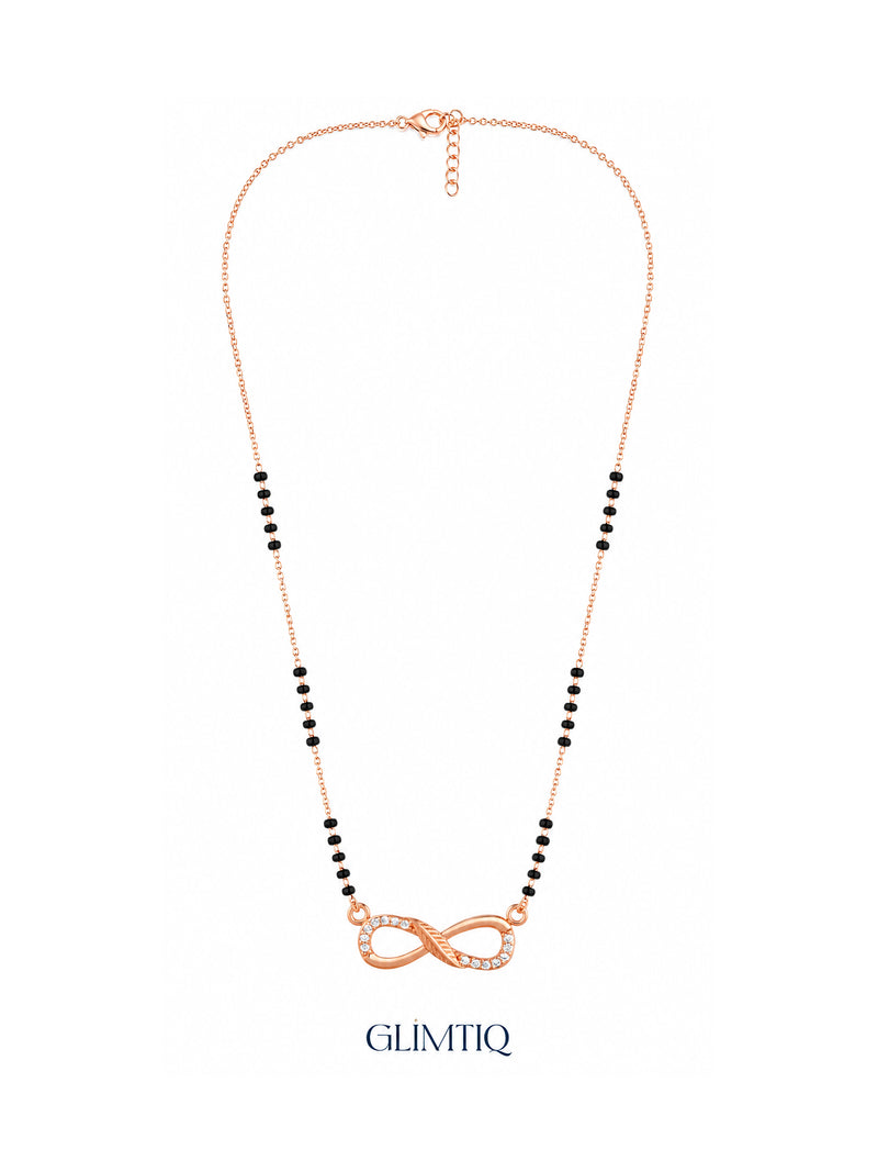 Full rose gold mangalsutra showing black bead sections, flowing infinity pendant with sparkling accents and textured centre detailing, lobster clasp and extension chain.