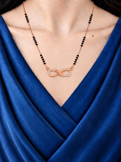 Sparkling Infinity mangalsutra with black beads shown worn on a model.