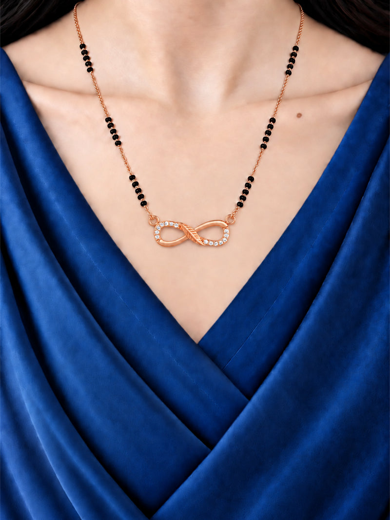 Sparkling Infinity mangalsutra with black beads shown worn on a model.