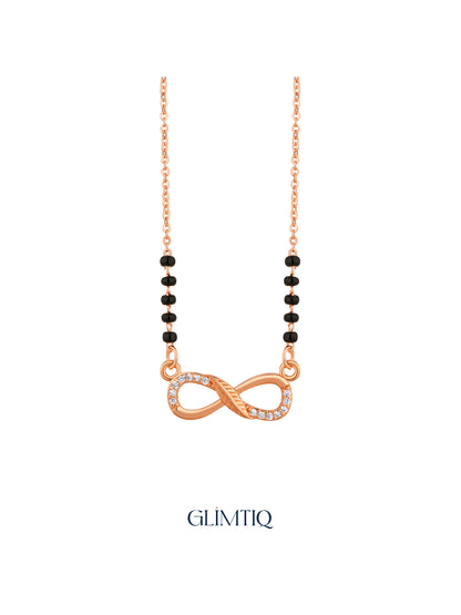Close-up of rose gold mangalsutra pendant featuring flowing infinity pendant with sparkling accents and textured centre detailing.