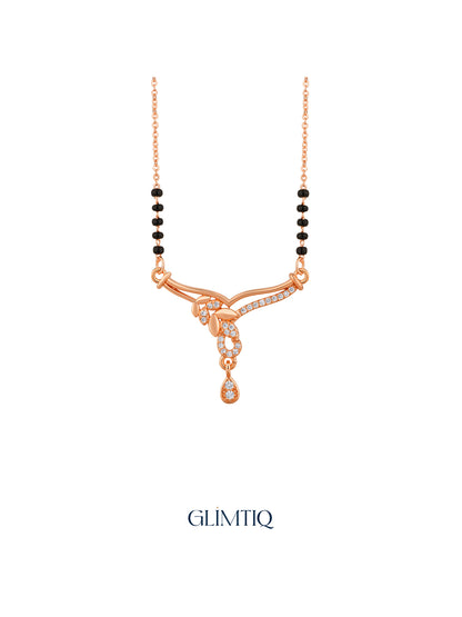 Close-up of rose gold mangalsutra pendant featuring flowing leaf trail with a sparkling open drop and hanging teardrop.