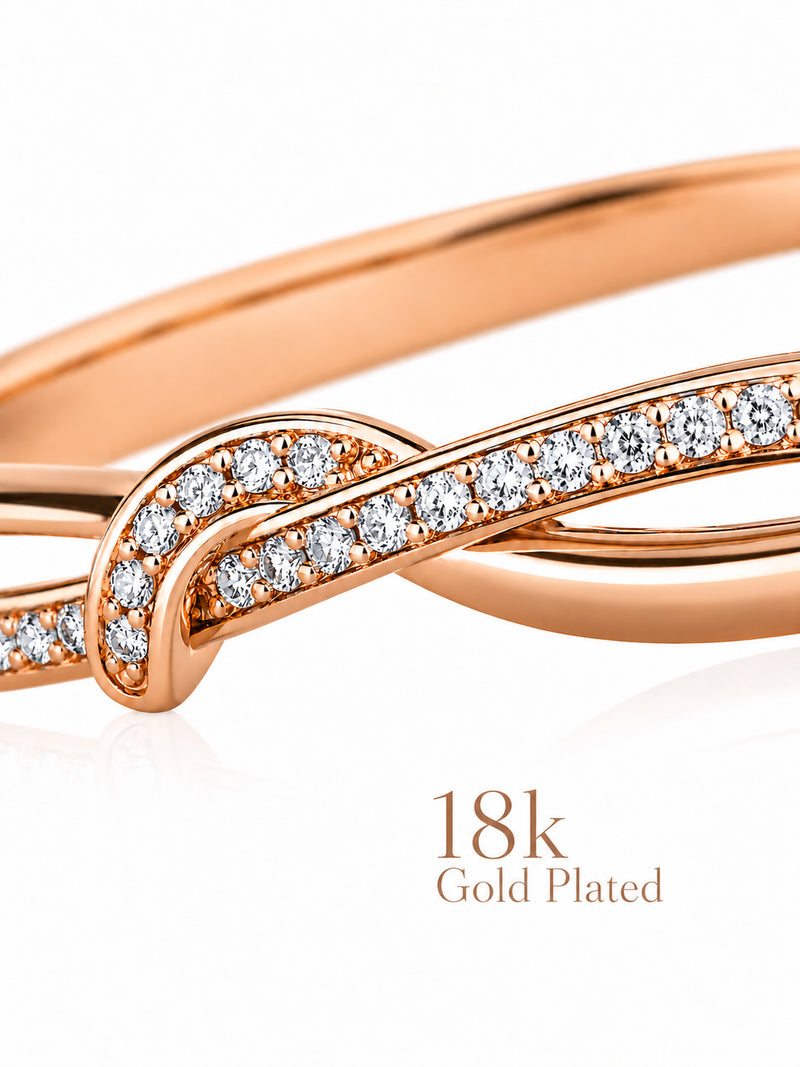 Close-up of Sparkling Twist bracelet’s crossing rose-gold curves and clear stones