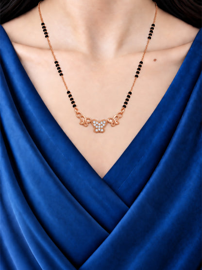 Three Shining Butterflies mangalsutra with black beads shown worn on a model.