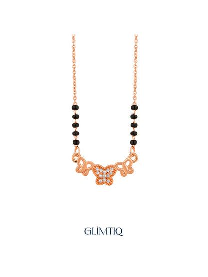 Close-up of rose gold mangalsutra pendant featuring three-butterfly pendant with a sparkling centre butterfly.