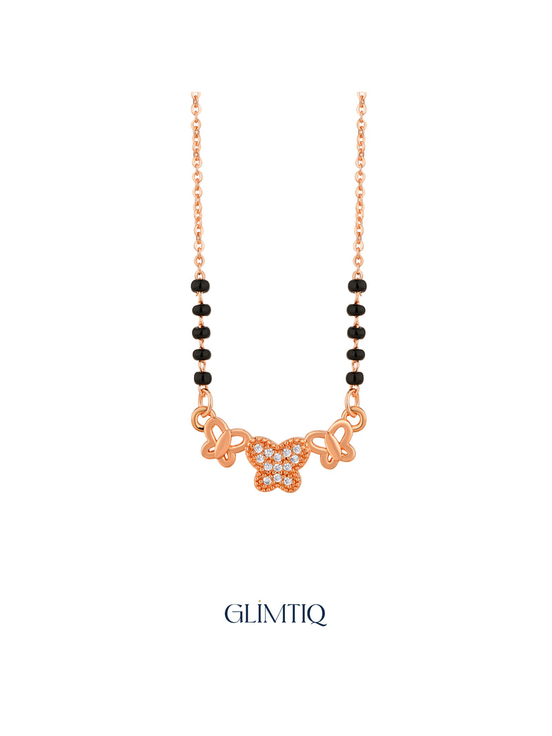 Close-up of rose gold mangalsutra pendant featuring three-butterfly pendant with a sparkling centre butterfly.