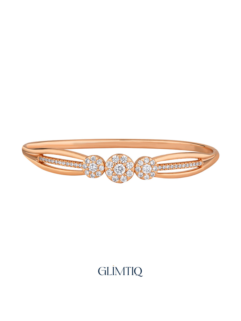 Three Shining Floral rose gold plated bracelet with three round floral motifs, studio view
