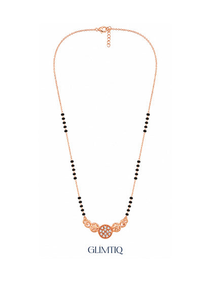 Full rose gold mangalsutra showing black bead sections, twin rose-gold stars framing a sparkling round centre, lobster clasp and extension chain.