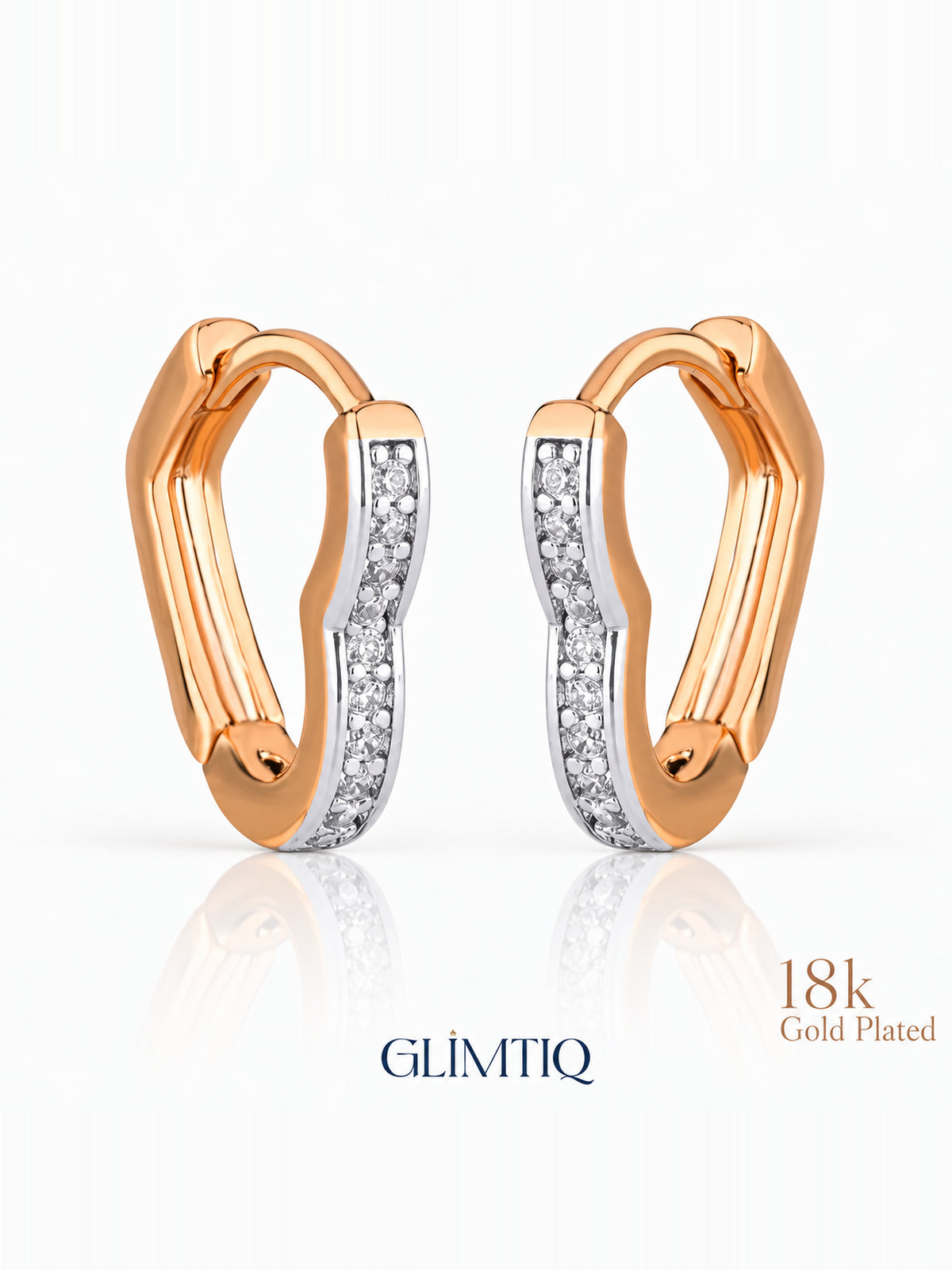 Close view of two tone curve 18k rose gold plated hoops showing gently curved two-tone hoop with clear accents