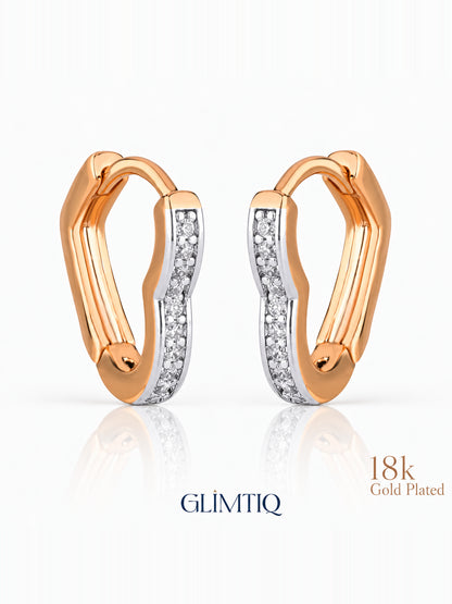 Close view of two tone curve 18k rose gold plated hoops showing gently curved two-tone hoop with clear accents
