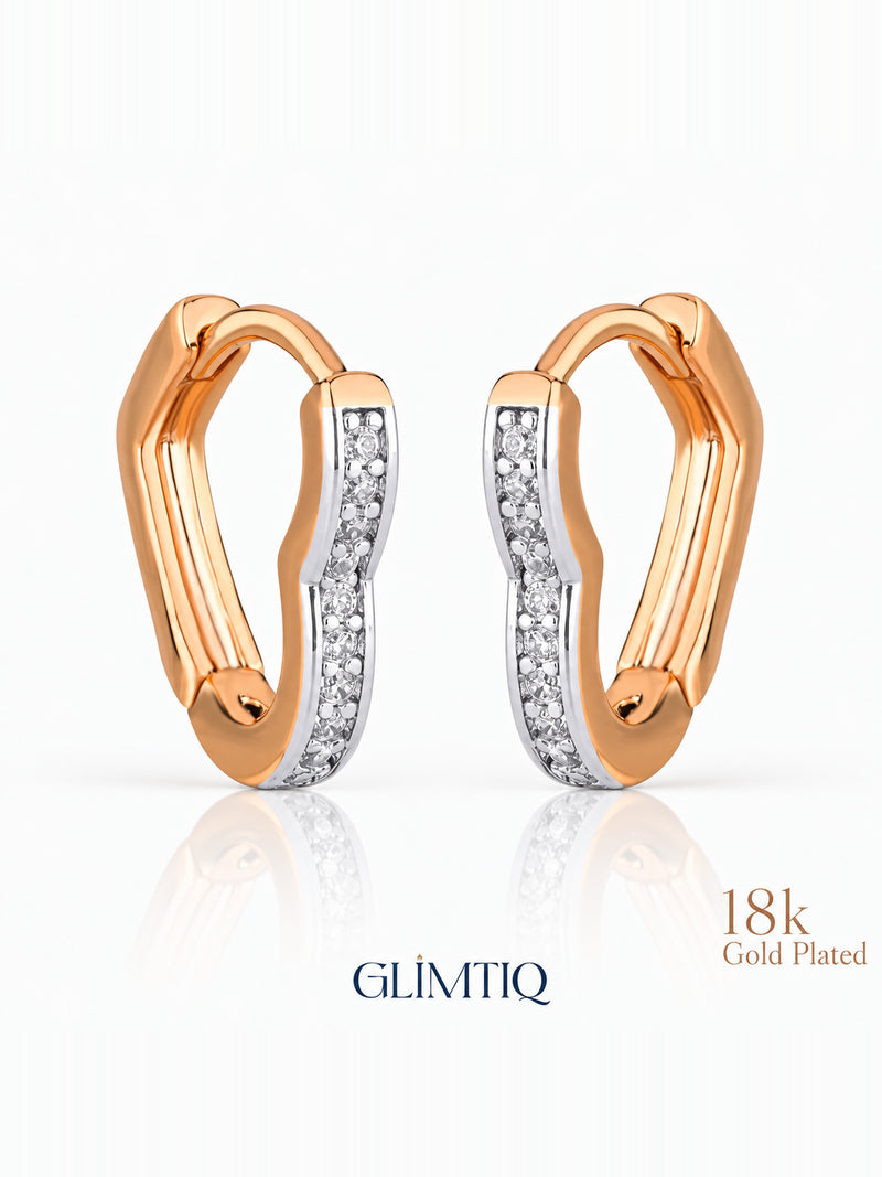 Close view of two tone curve 18k rose gold plated hoops showing gently curved two-tone hoop with clear accents