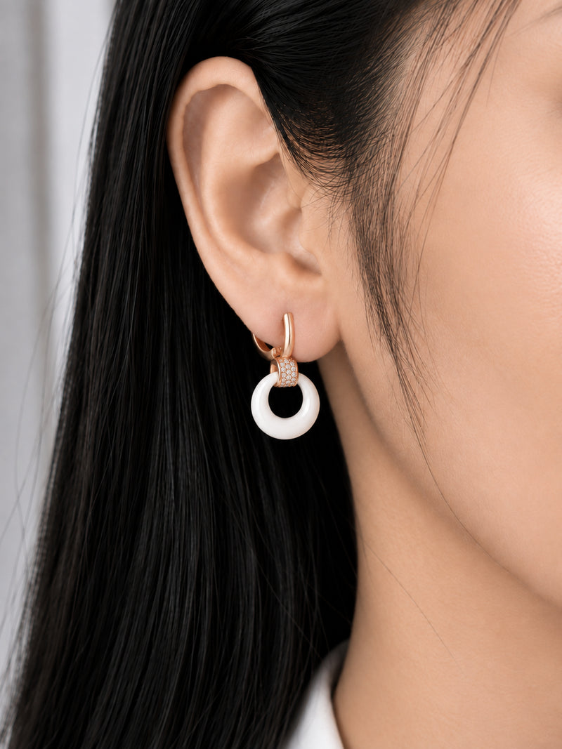 White Halo 18K Rose Gold Plated Drop Earrings worn on a model's ear